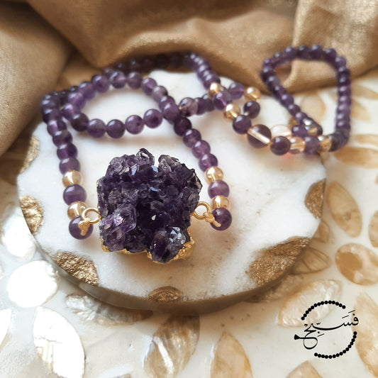 An absolutely stunning amethyst crystal pendant with 24K gold plating, paired with some lovely amethyst beads. Packaged in a luxurious pouch and a gift box. 99 beads