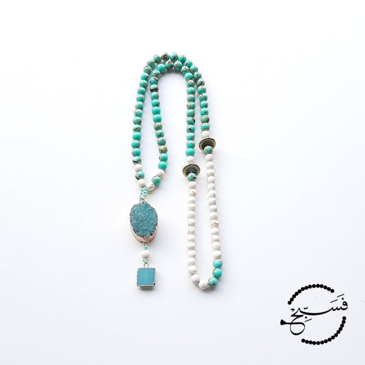 These sea sediment beads are the most gorgeous shade of turquoise! They look especially striking when paired with the beige beads. We've used a druzy pendant and a mini amazonite pendant to finish off this tasbih. Packaged in a luxurious pouch and gift box. 99 beads