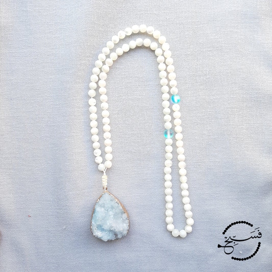 A large ice blue druzy pendant, with natural white trochus shell beads. The spacers are blue Austrian moonstone, to add just a hint of colour. Packaged in a luxurious pouch and a gift box. 99 beads
