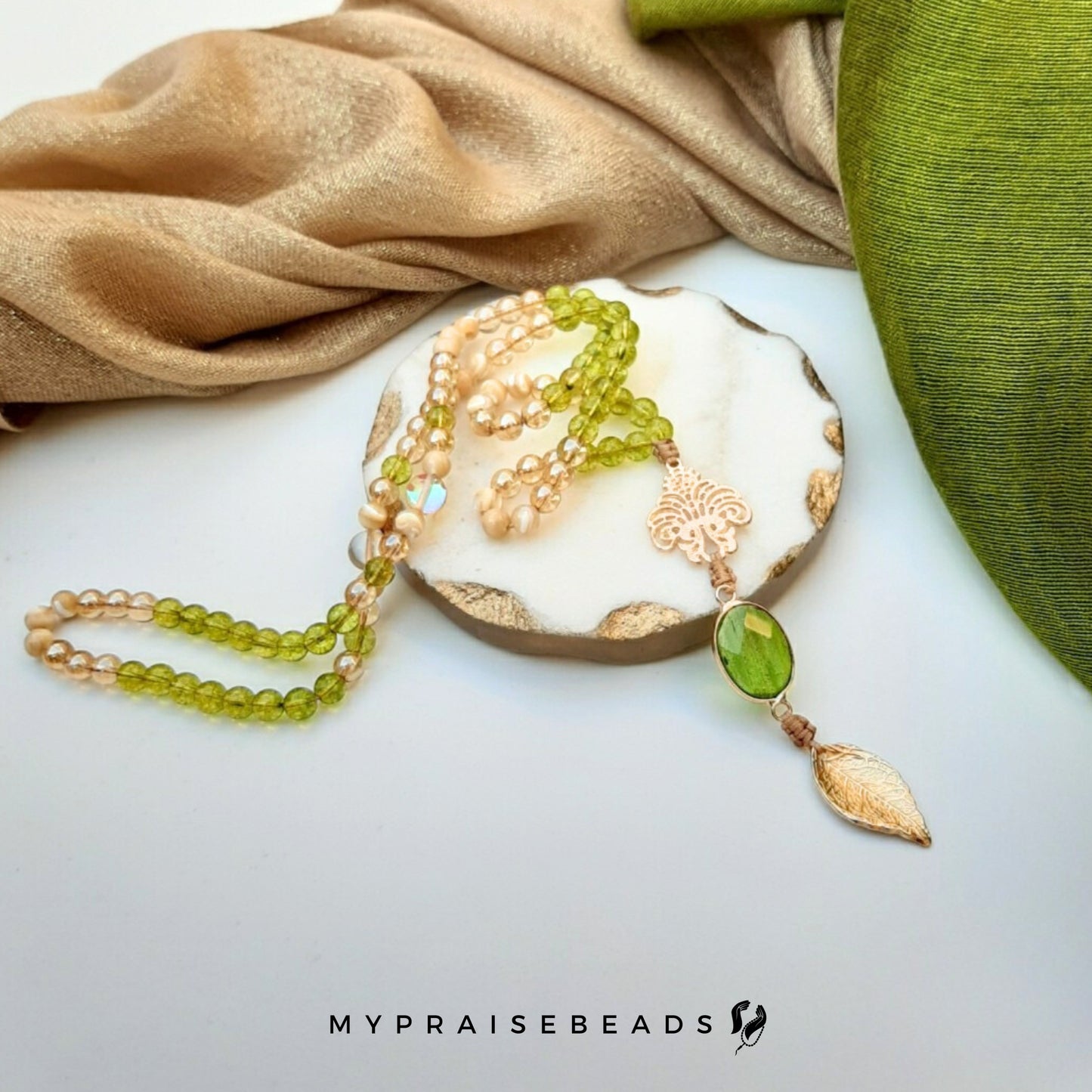 Peridot, Gold & Trochus Shell Tasbih