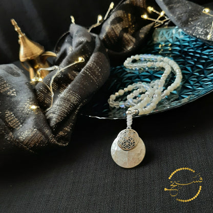 These beautiful shell pendants come in white or grey, with a silver geometric design overlay. We've used trochus shell, moonstone and agate beads to create these pieces.  Packaged in a luxurious pouch and a gift box.  99 beads