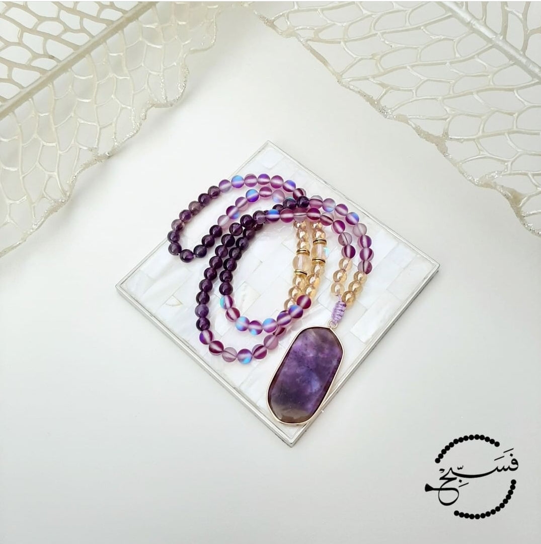 This tasbih has an amethyst pendant with amethyst, purple moonstone and gold beads.  Packaged in a luxurious pouch and a gift box.  99 beads