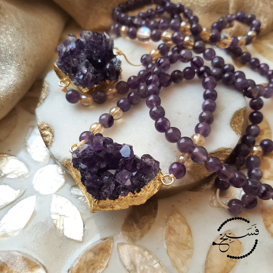 An absolutely stunning amethyst crystal pendant with 24K gold plating, paired with some lovely amethyst beads.   Packaged in a luxurious pouch and a gift box.  99 beads