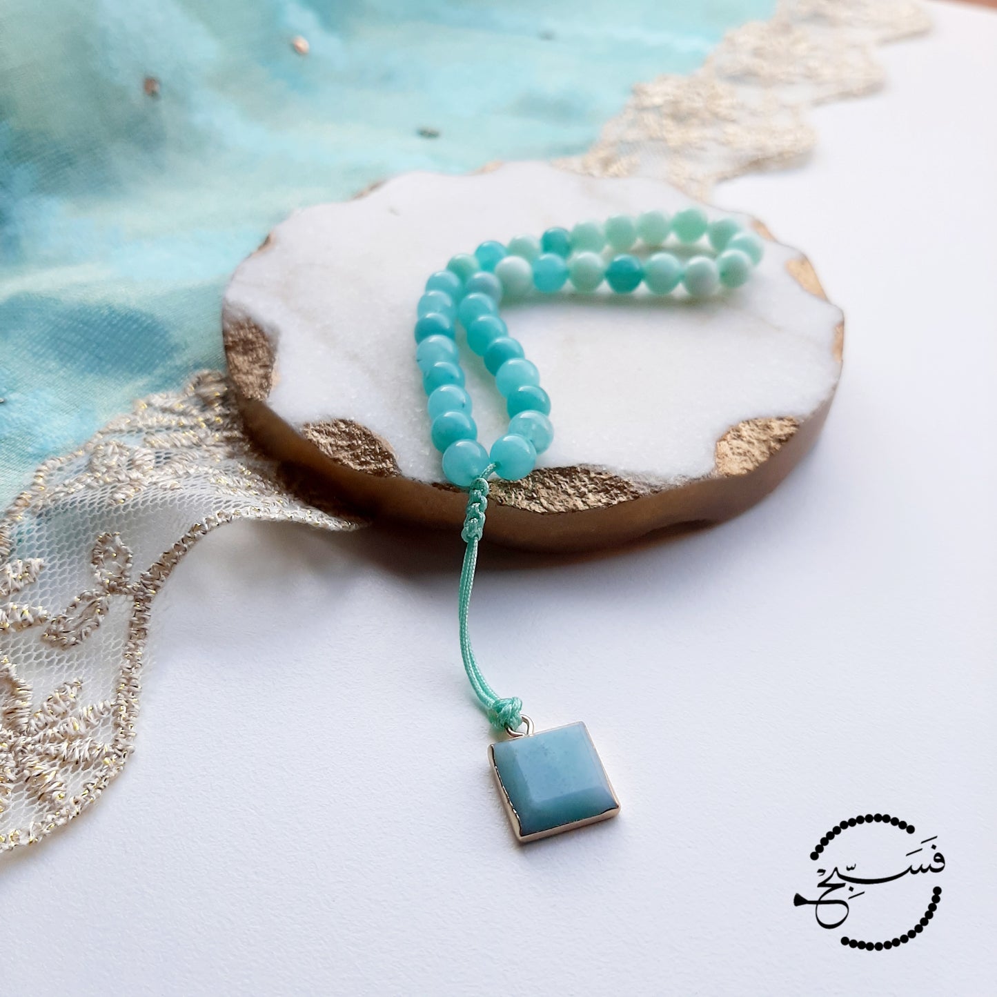 Amazonite beads, with amazonite pendant.  Features an adjustable knot.  33 beads (6mm beads)