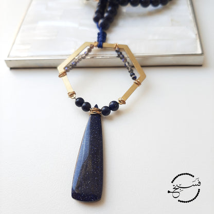 Dramatic. Dark blue sandstone, which is almost glittery, is used throughout this design, except for the tiny beads, which are obsidian.   Packaged in a luxurious pouch and a gift box.  99 beads