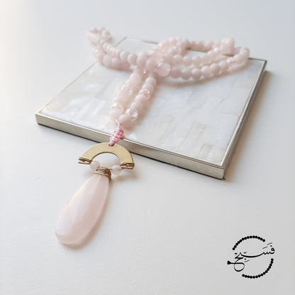 Don't you just love the delicate pink shade of rose quartz? This piece features a beautiful rose quartz stone, paired with rose quartz beads and pink crystal beads.  Packaged in a luxurious pouch and a gift box.  99 beads