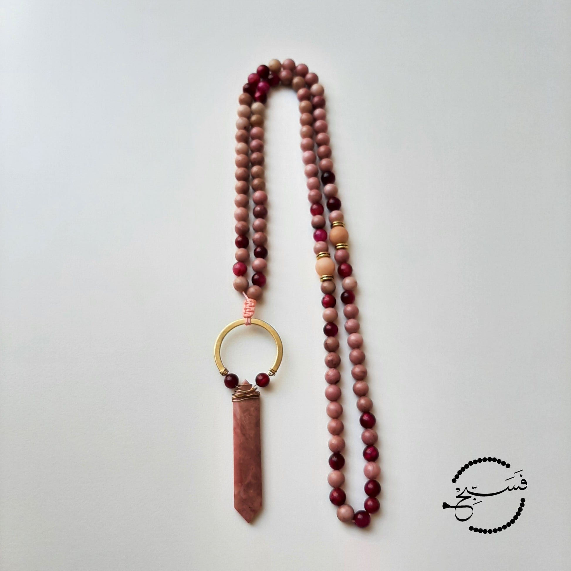Rhodonite paired with striking red tiger eye.  Packaged in a luxurious pouch and a gift box.  99 beads