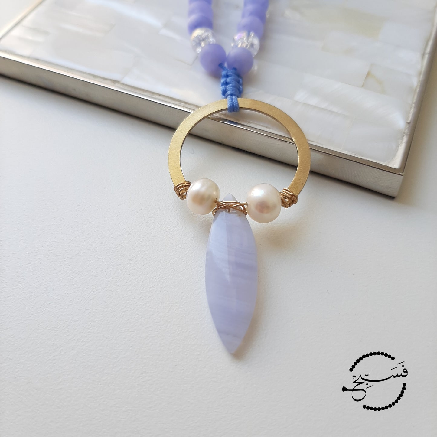 Can a blue be more feminine? Beautiful pale blue lace agate and pearl pendant, with stone beads to complement it.  Packaged in a luxurious pouch and a gift box.  99 beads