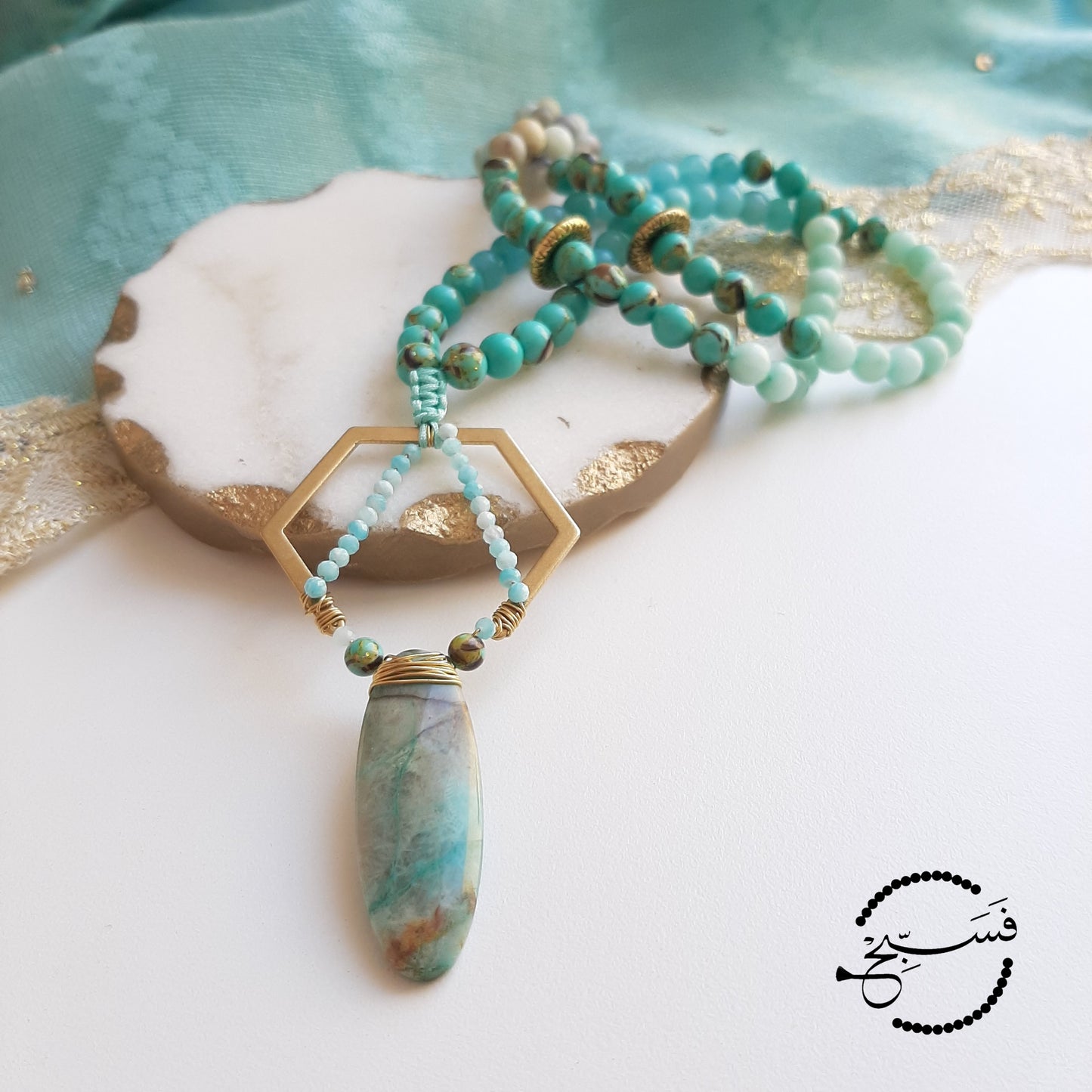 Beautiful chrysocolla stone, set with amazonite in a hexagon. The beads are natural amazonite and sea sediment.  Packaged in a luxurious pouch and a gift box.  99 beads