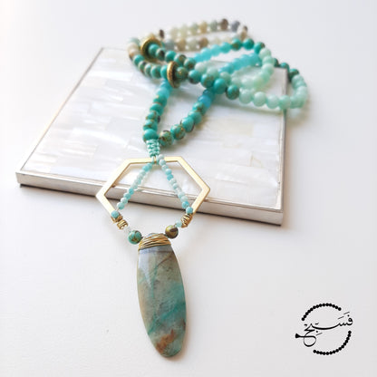Beautiful chrysocolla stone, set with amazonite in a hexagon. The beads are natural amazonite and sea sediment.  Packaged in a luxurious pouch and a gift box.  99 beads