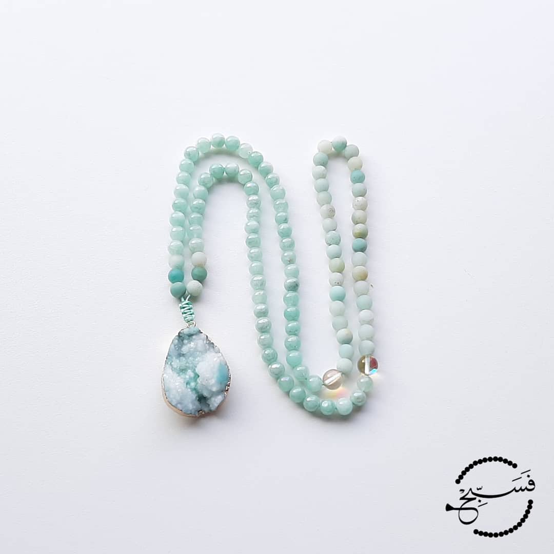 These pale green beads are gorgeous, made of natural stone and AB plated, they have a lovely shine to them. They are paired with matte amazonite beads and a beautiful druzy pendant.  Packaged in a luxurious pouch and a gift box.  99 beads