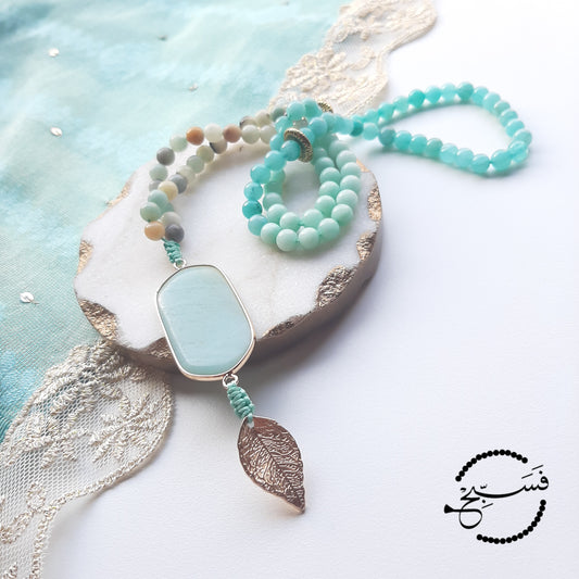 Shades of amazonite. With a gorgeous double pendant and a hint of gold for subtle glamour.  Packaged in a luxurious pouch and a gift box.  99 beads