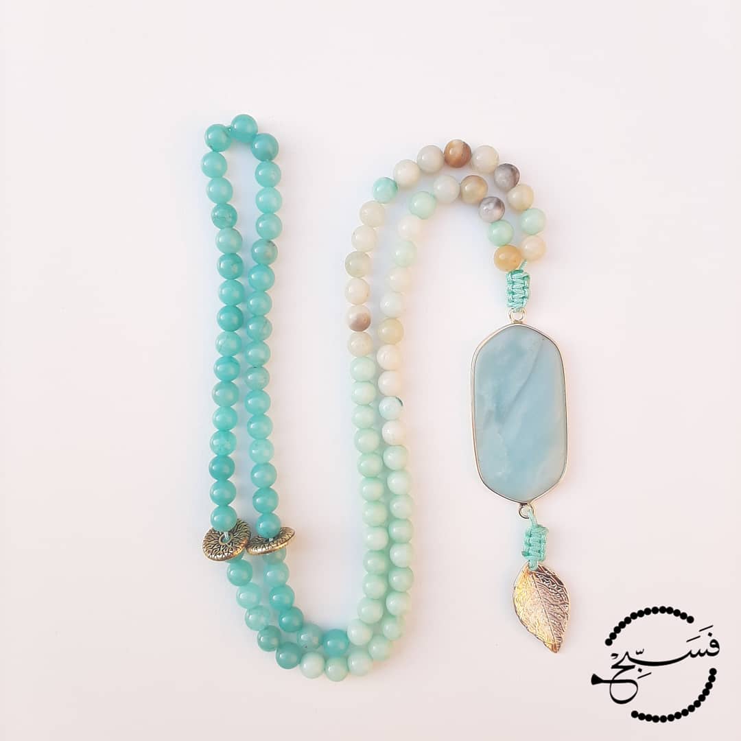 Shades of amazonite. With a gorgeous double pendant and a hint of gold for subtle glamour.  Packaged in a luxurious pouch and a gift box.  99 beads