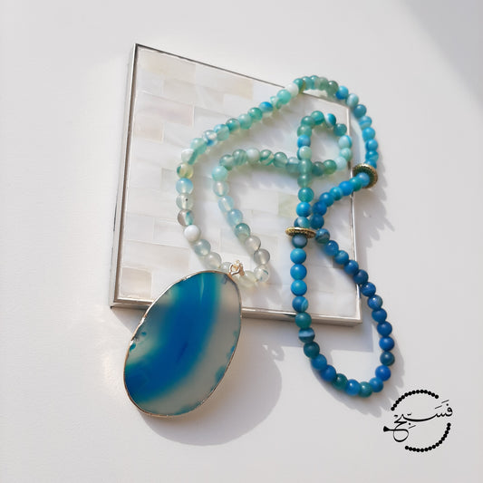 Smooth blue agate pendant and beads.  Packaged in a luxurious pouch and a gift box.  99 beads