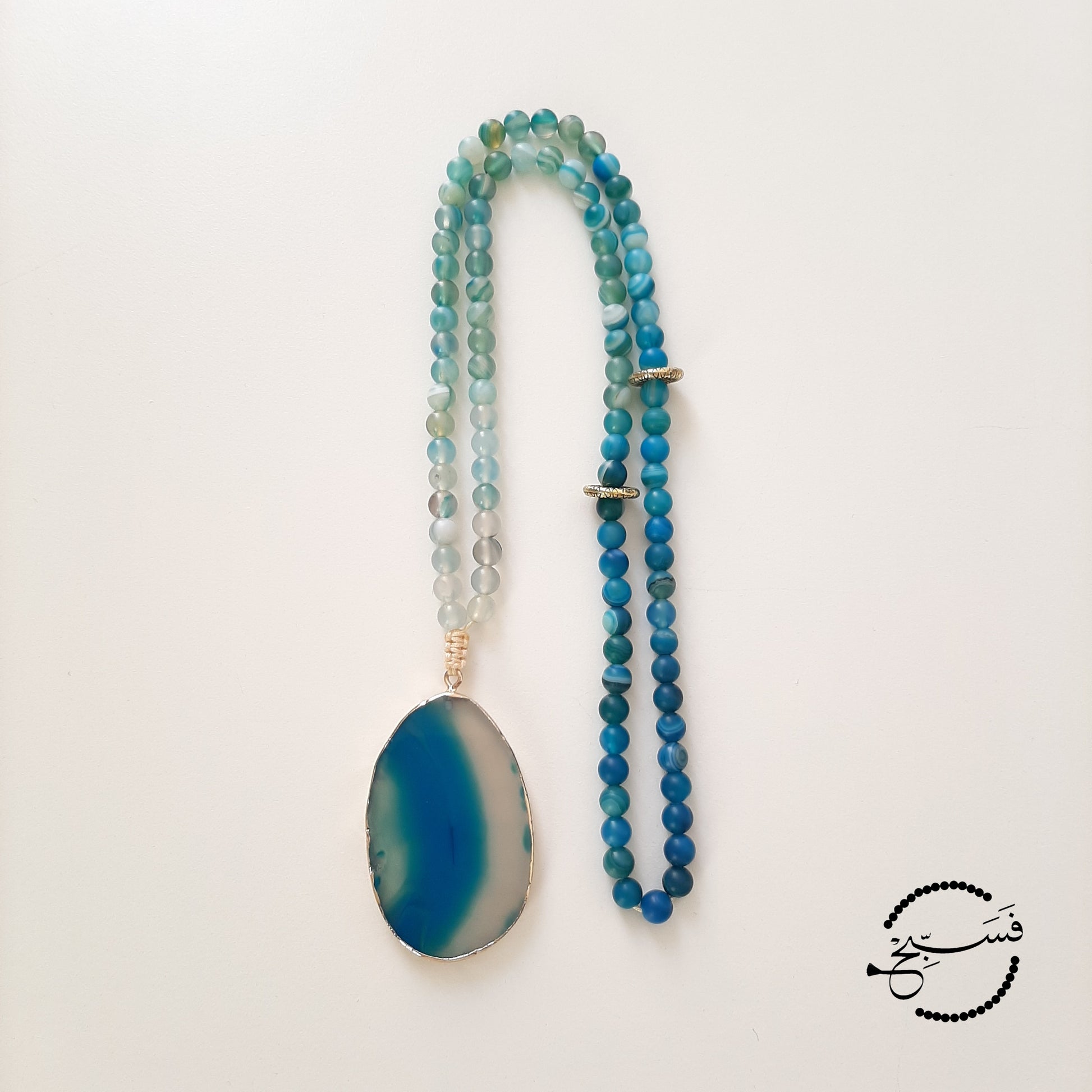 Smooth blue agate pendant and beads.  Packaged in a luxurious pouch and a gift box.  99 beads