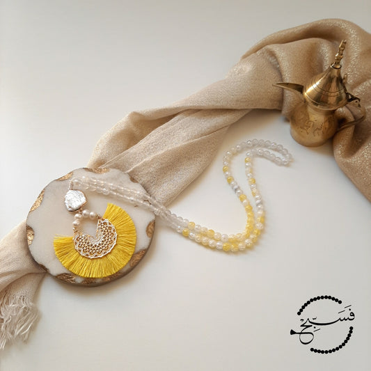 White agate beads, with a splash of yellow! The pendant is handcrafted with pearls and a yellow fan tassel. Packaged in a luxurious pouch and a gift box.  99 beads