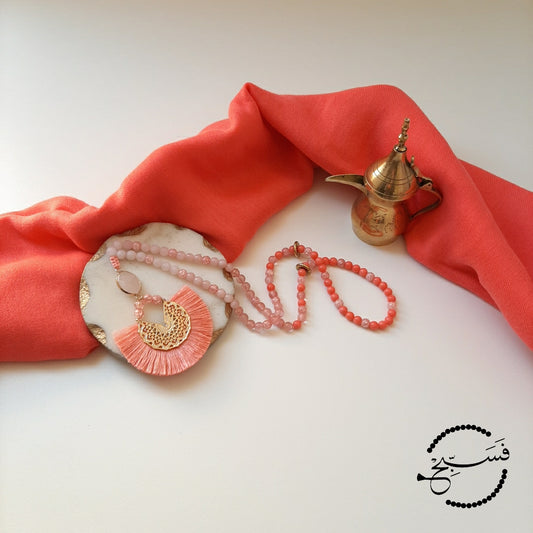 A lovely vibrant piece, made from coral, watermelon quartz and rose quartz. Finished with a faceted rose quartz pendant and a vivid tassel.  Packaged in a luxurious pouch and a gift box.  99 beads