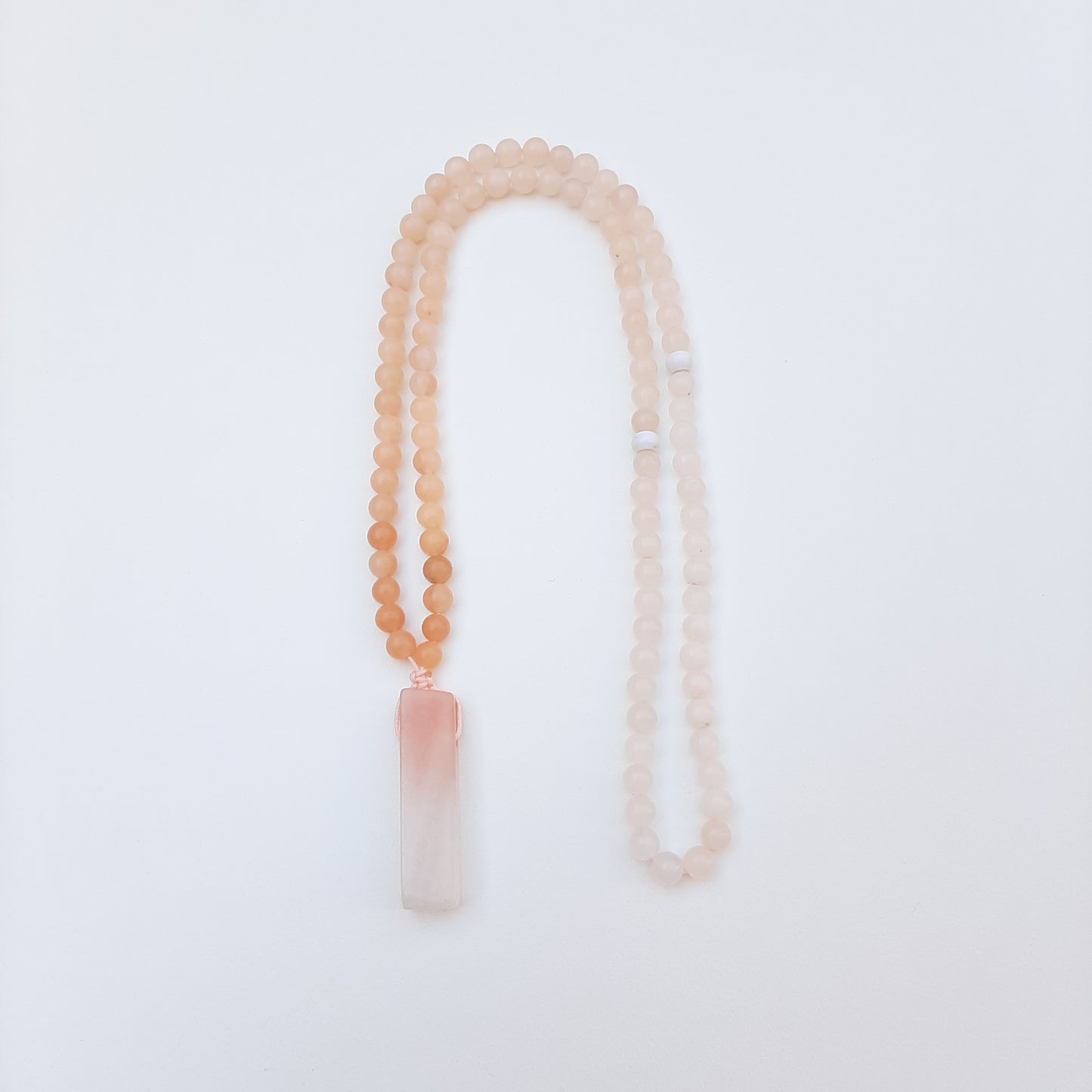 Pink aventurine. Soft and subtle shades of peach and white create a beautiful ombre effect.  Packaged in a luxurious pouch and a gift box.  99 beads