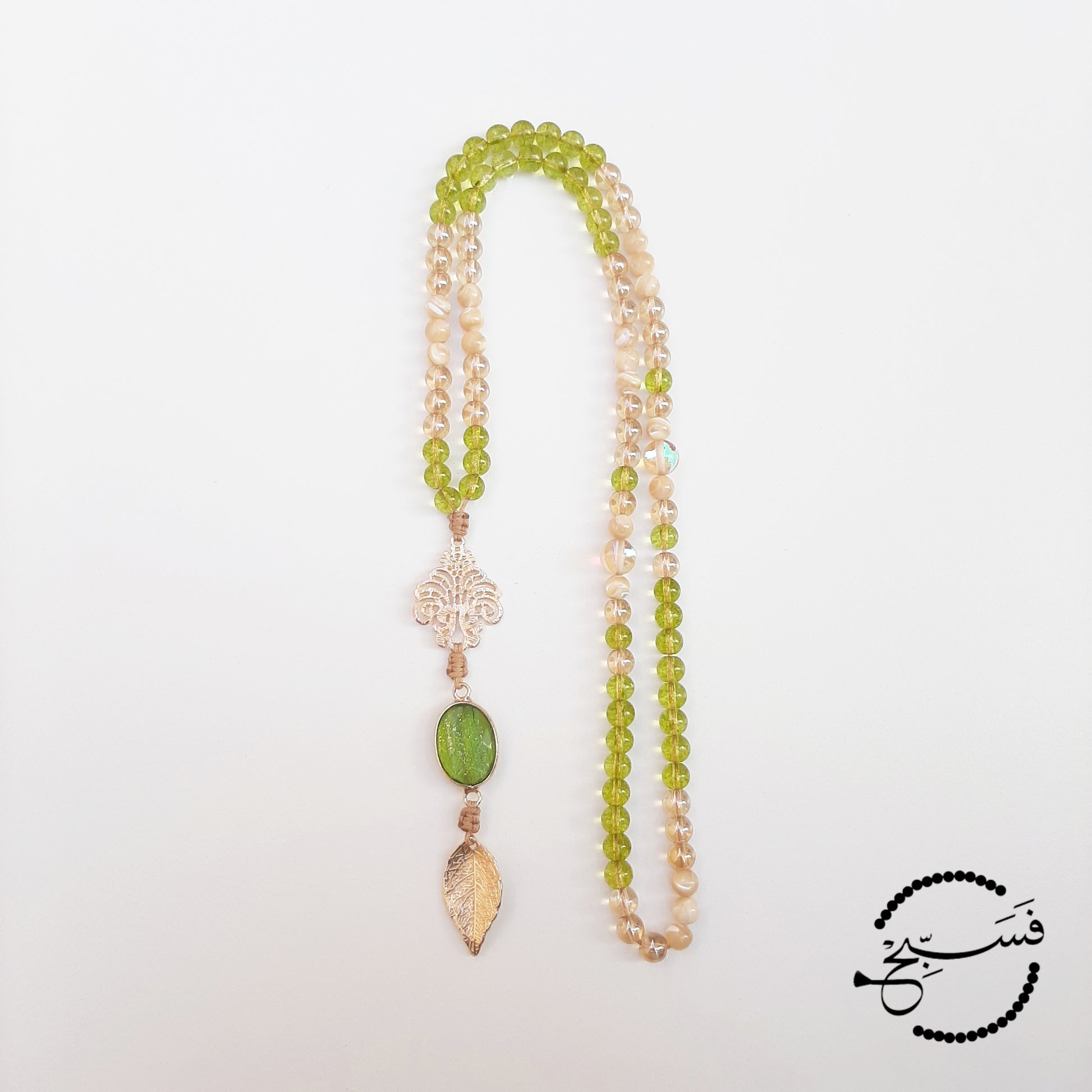 Peridot with gold and trochus shell beads make a truly glamorous tasbih.  Packaged in a luxurious pouch and a gift box.  99 beads