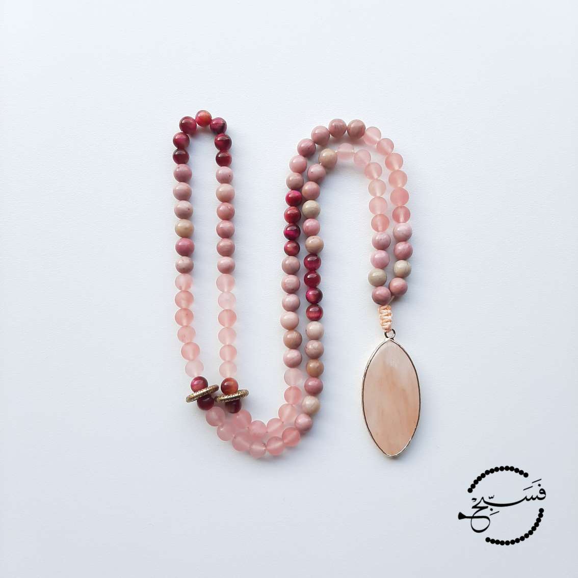 This piece is made from watermelon quartz, pink rhodonite and rose tiger eye beads. A beautifully shaped quartz pendant completes the piece.  Packaged in a luxurious pouch and a gift box.  99 beads