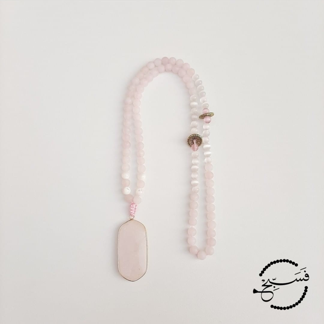 This glorious tasbih has a rose quartz pendant and beads with glossy white cat eye beads.  Comes packaged in a luxurious pouch and a gift box.  99 beads