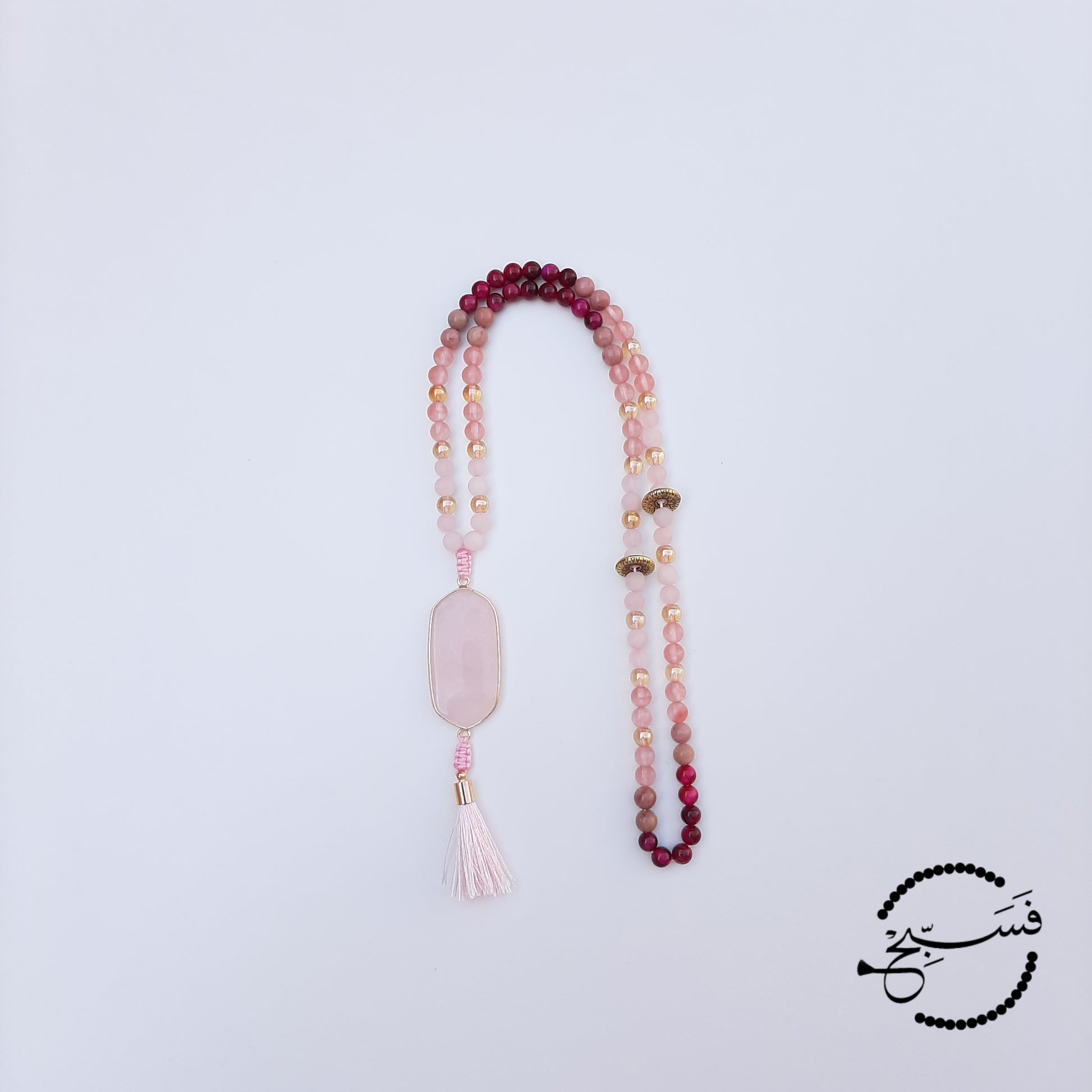 These pieces are made from watermelon and rose quartz, rhodonite, and fuchsia tiger eye beads. A beautifully shaped rose quartz pendant and pink tassel complete the piece.  Comes packaged in a luxurious pouch and a gift box.  99 beads