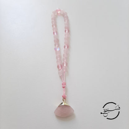 Rose quartz and moonstone beads, with a rose quartz pendant.  Features an adjustable knot.  33 beads (6mm beads)