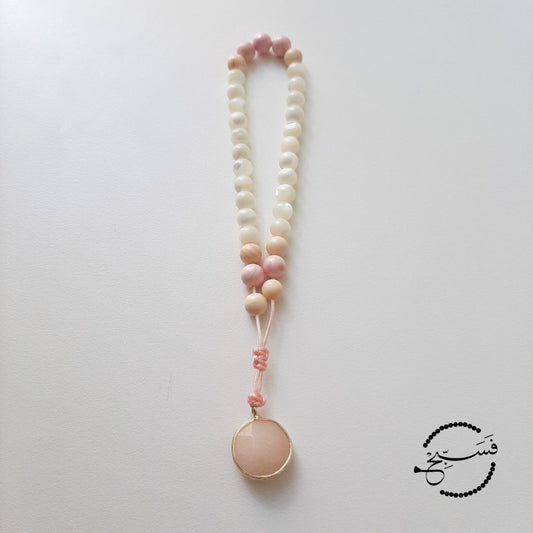 Natural trochus and tridacna shell bracelet, with a jasper pendant. This one matches perfectly with the 99 bead tasbih.  Features an adjustable knot.  33 beads (6mm beads)