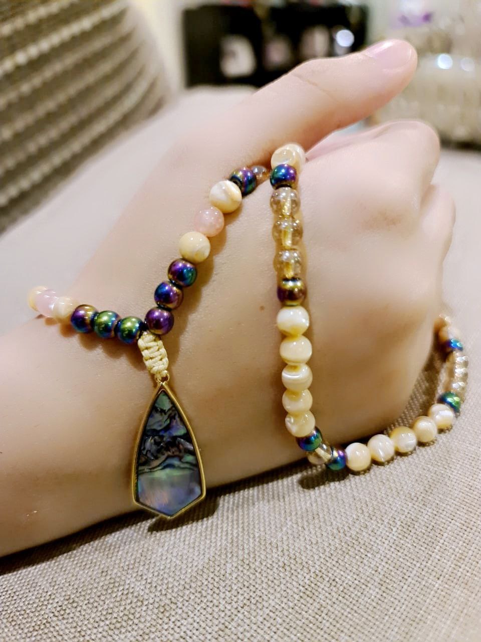 Abalone pendant, with natural trochus shell, sunstone and hematite beads. The spacers are stunning abalone shell beads and match the pendant perfectly.  Packaged in a luxurious pouch and a gift box.  99 beads