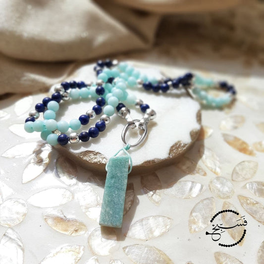 A piece of natural amazonite forms the pendant of this tasbih/necklace, which has a silver-tone clasp for easy opening. The beads are natural amazonite and lapis lazuli.