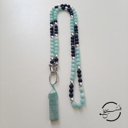 A piece of natural amazonite forms the pendant of this tasbih/necklace, which has a silver-tone clasp for easy opening. The beads are natural amazonite and lapis lazuli.