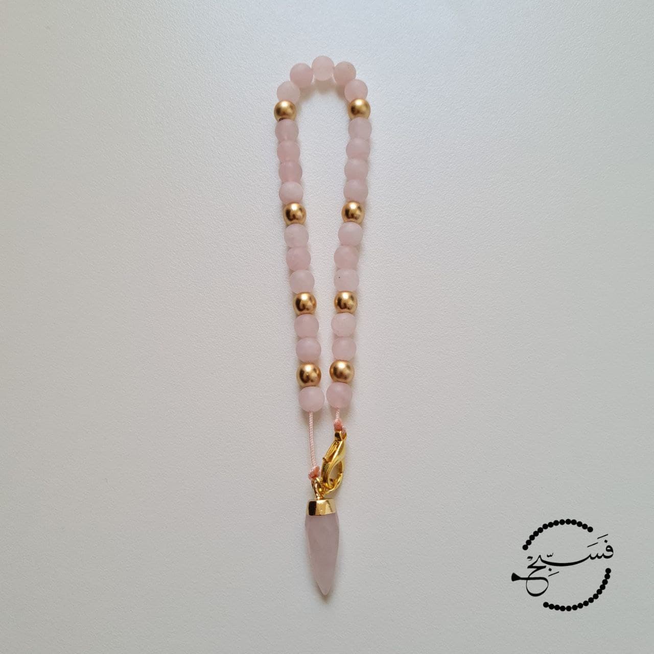 Rose quartz bag charm for dhikr on the go!   33 bead tasbih that can be attached to your bag.   Packaged in a luxurious pouch and a gift box.